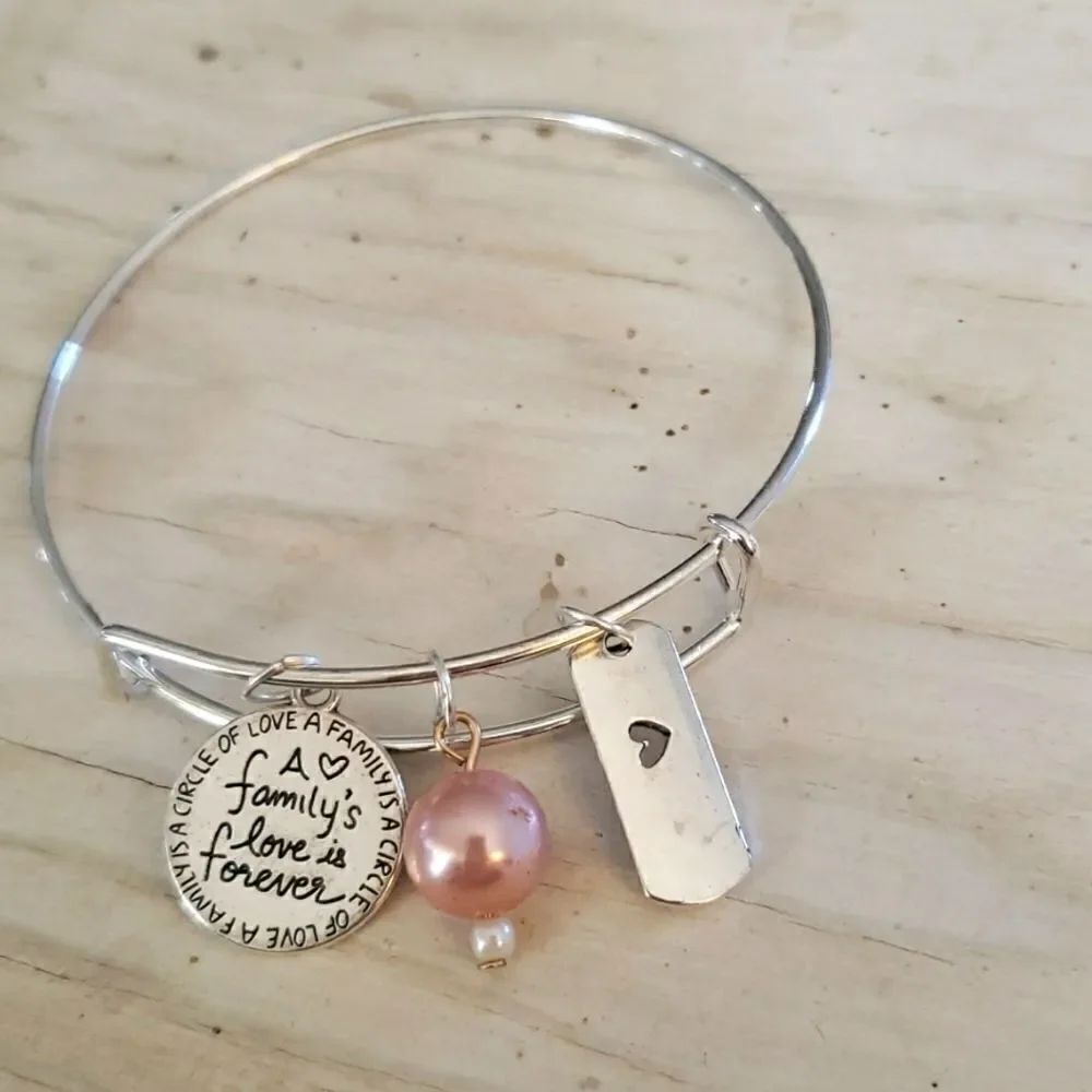Bracelets by Sandra silver tone adjustable, A family's love is forever